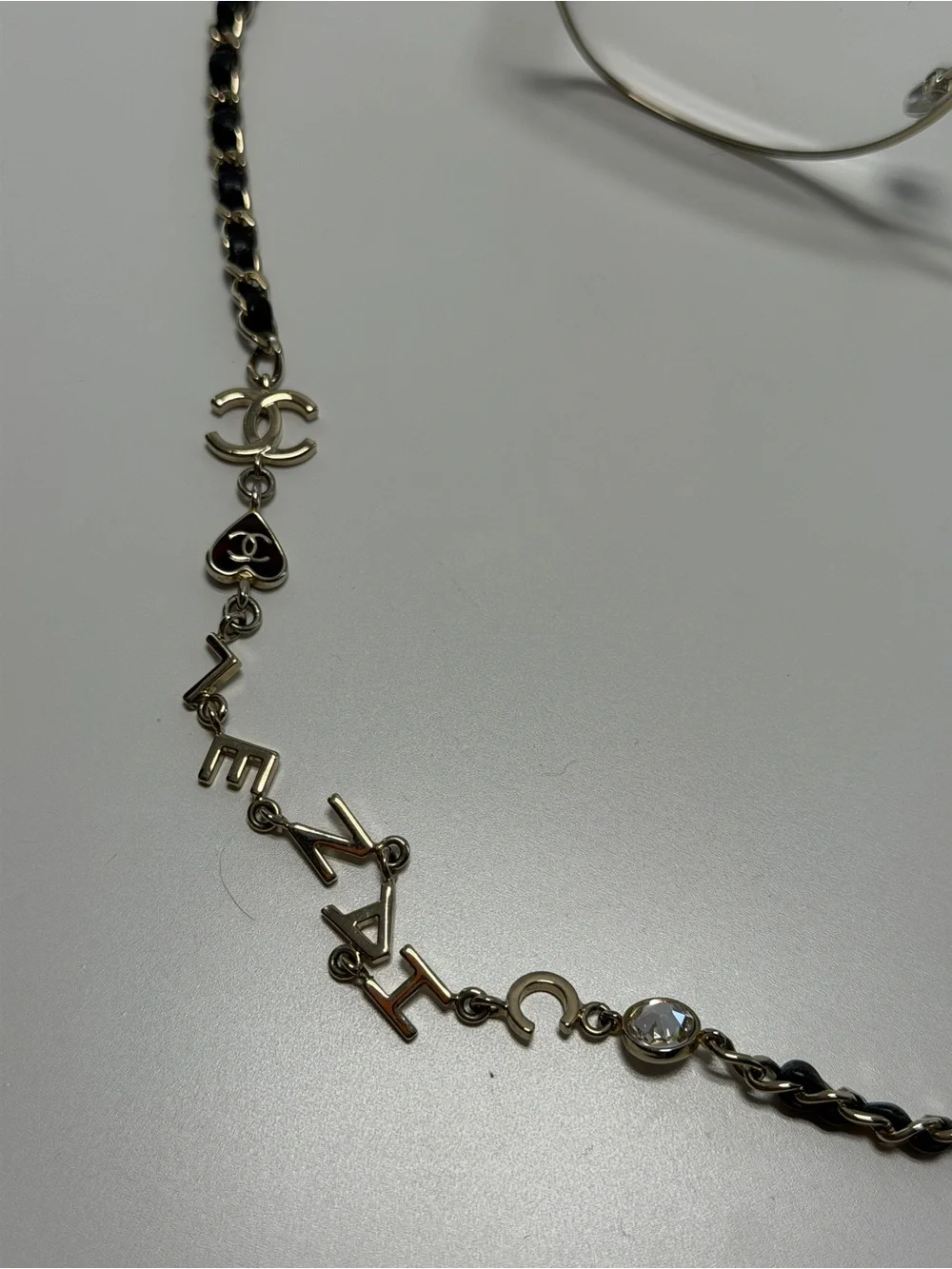 CHANEL  Gold and Black Eye ear Chain with Silver-Tone Glasses